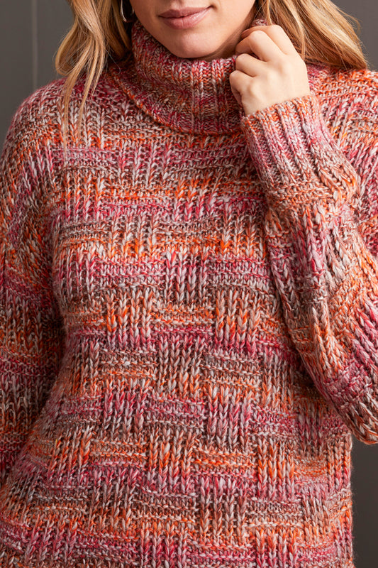 A person wearing a multicolored, fashionable long sleeve cowl neck sweater by Tribal with a textured pattern.