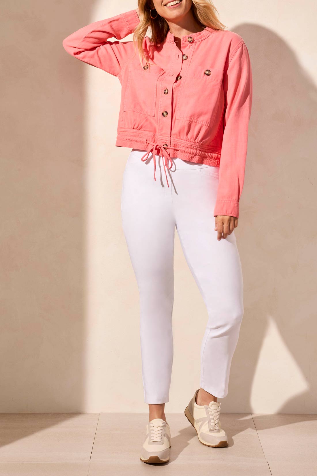 The Tribal BUTTON UP JACKET WITH DRAWCORD, in a stylish pink, features a button-up design with two front pockets and a waist drawstring, making it the perfect match for white pants this spring.