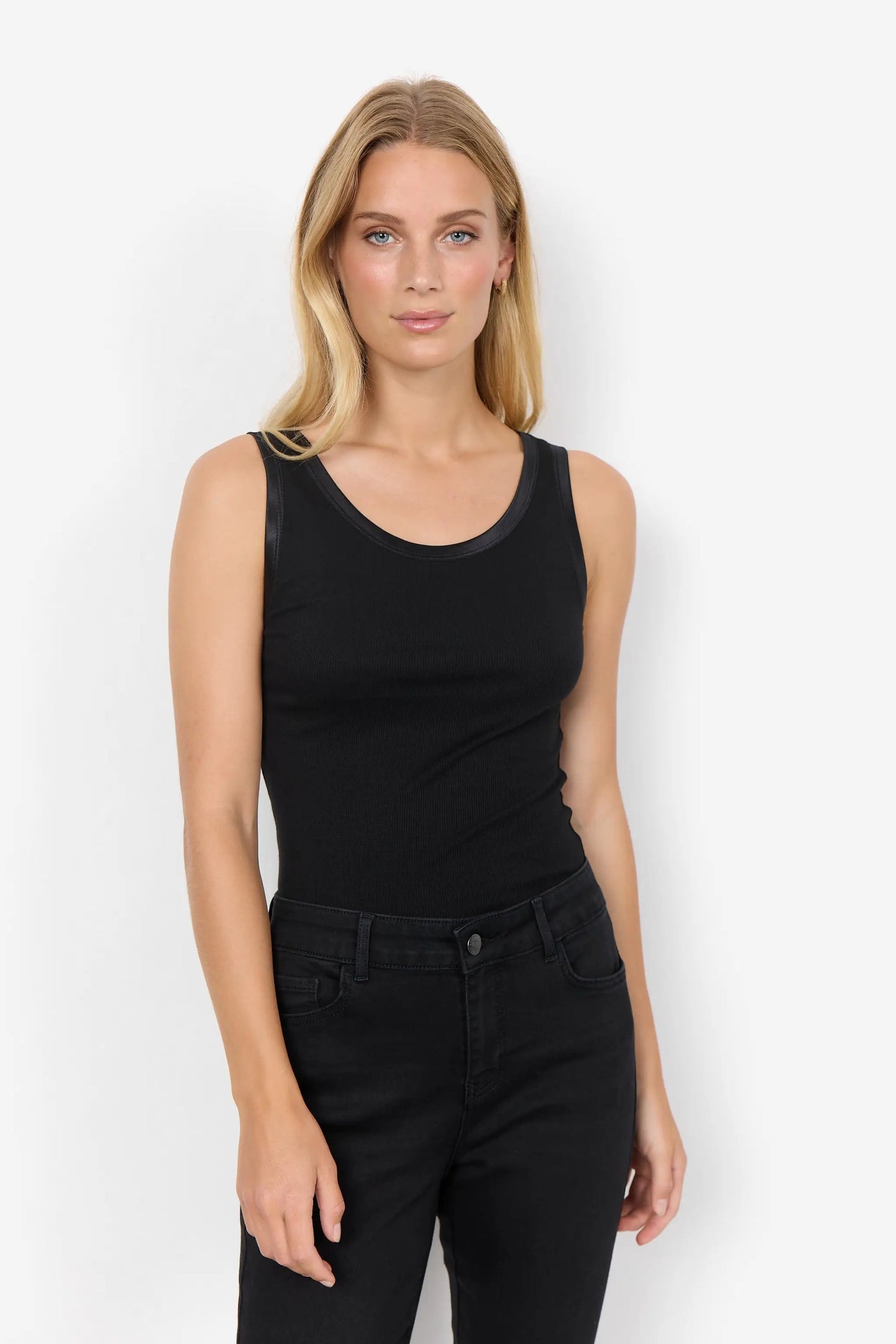 A woman with long blonde hair wearing the Ryan 1 Basic Top by Soya Concepts, crafted from sustainable LENZING™ ECOVERO™, looks directly at the camera against a plain white background.