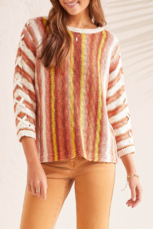 A woman wearing a Tribal 3/4 Sleeve Lace Up Boat Neck Sweater.