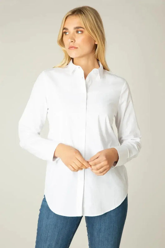 A woman wearing a Basic Level Basic White Button Up shirt.