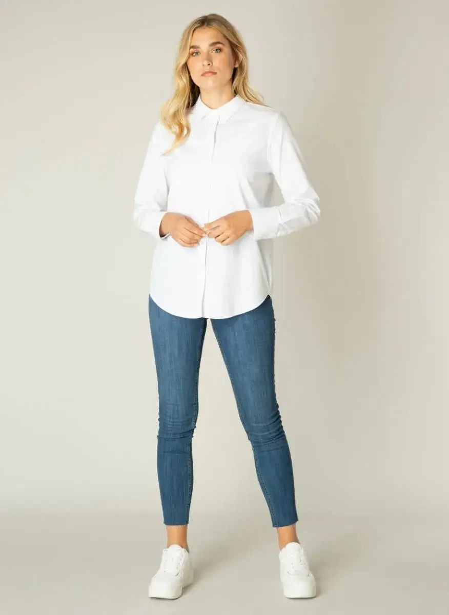 A woman wearing a Basic Level Basic White Button Up shirt.