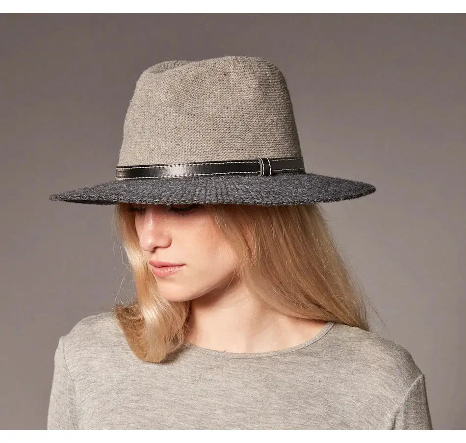 A woman wearing a Canadian Hat Marshall Hat with a vegan leather band.