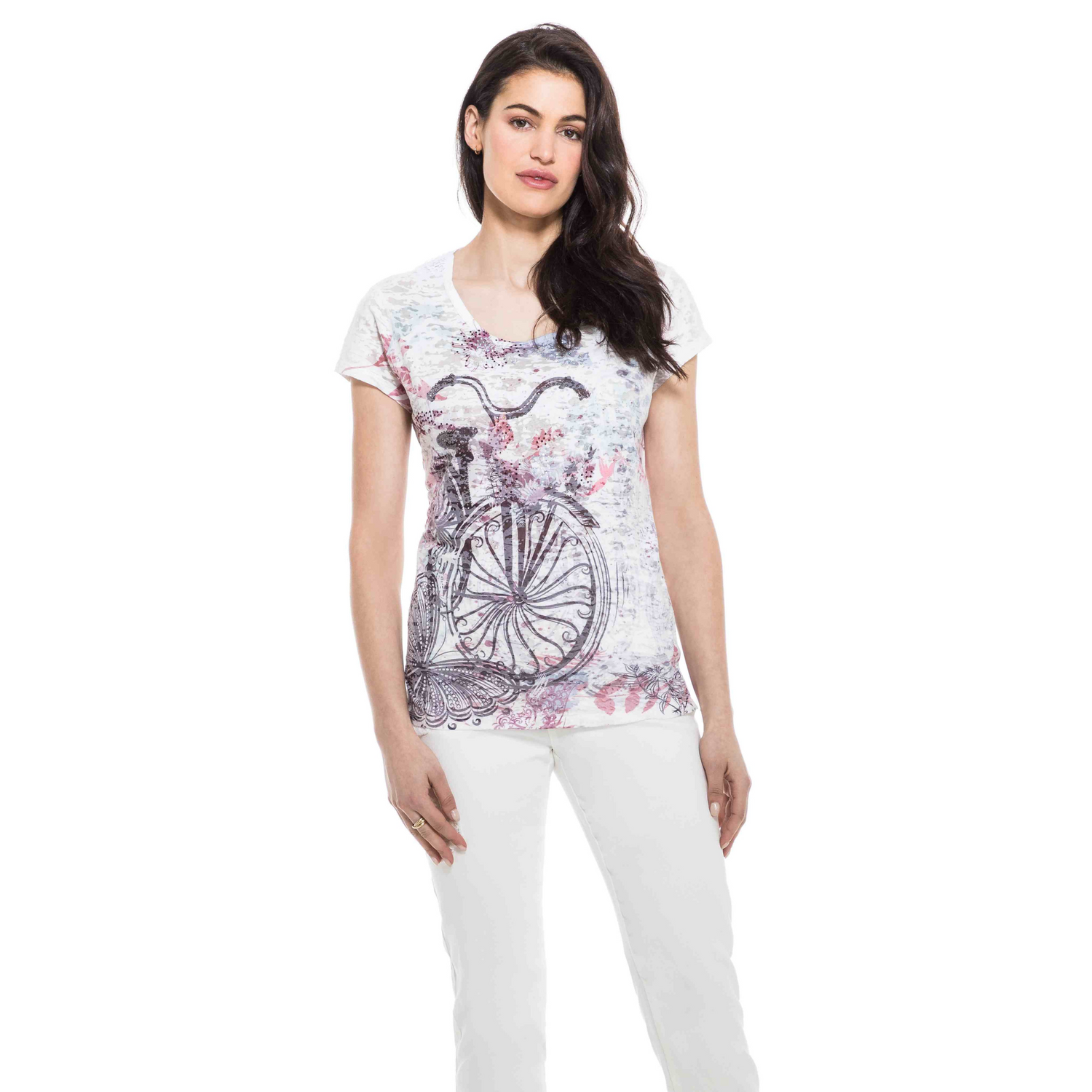 Woman posing in a cute and comfortable Orly Round Neck SS Tee with bicycle print and white pants.