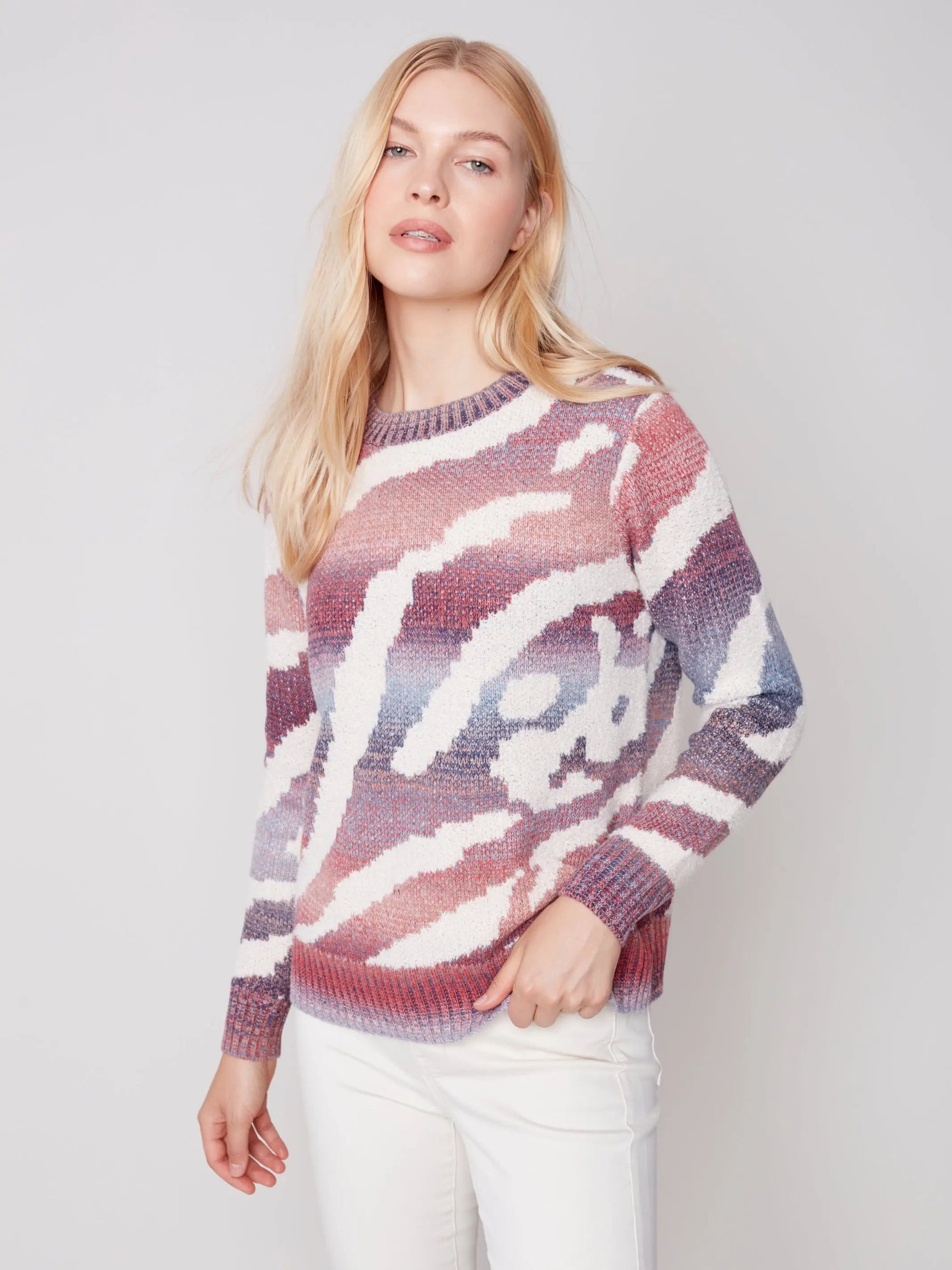 A woman wearing a Charlie B Ruby Crew Neck Sweater.