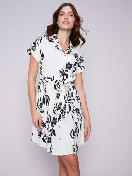 A modern white and black floral print Charlie B shirt dress, featuring unique design with short sleeves.