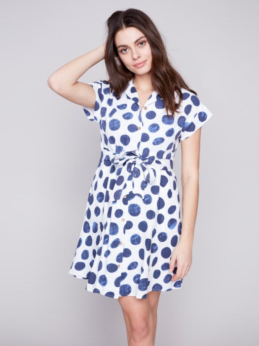 A modern white and black floral print Charlie B shirt dress, featuring unique design with short sleeves.