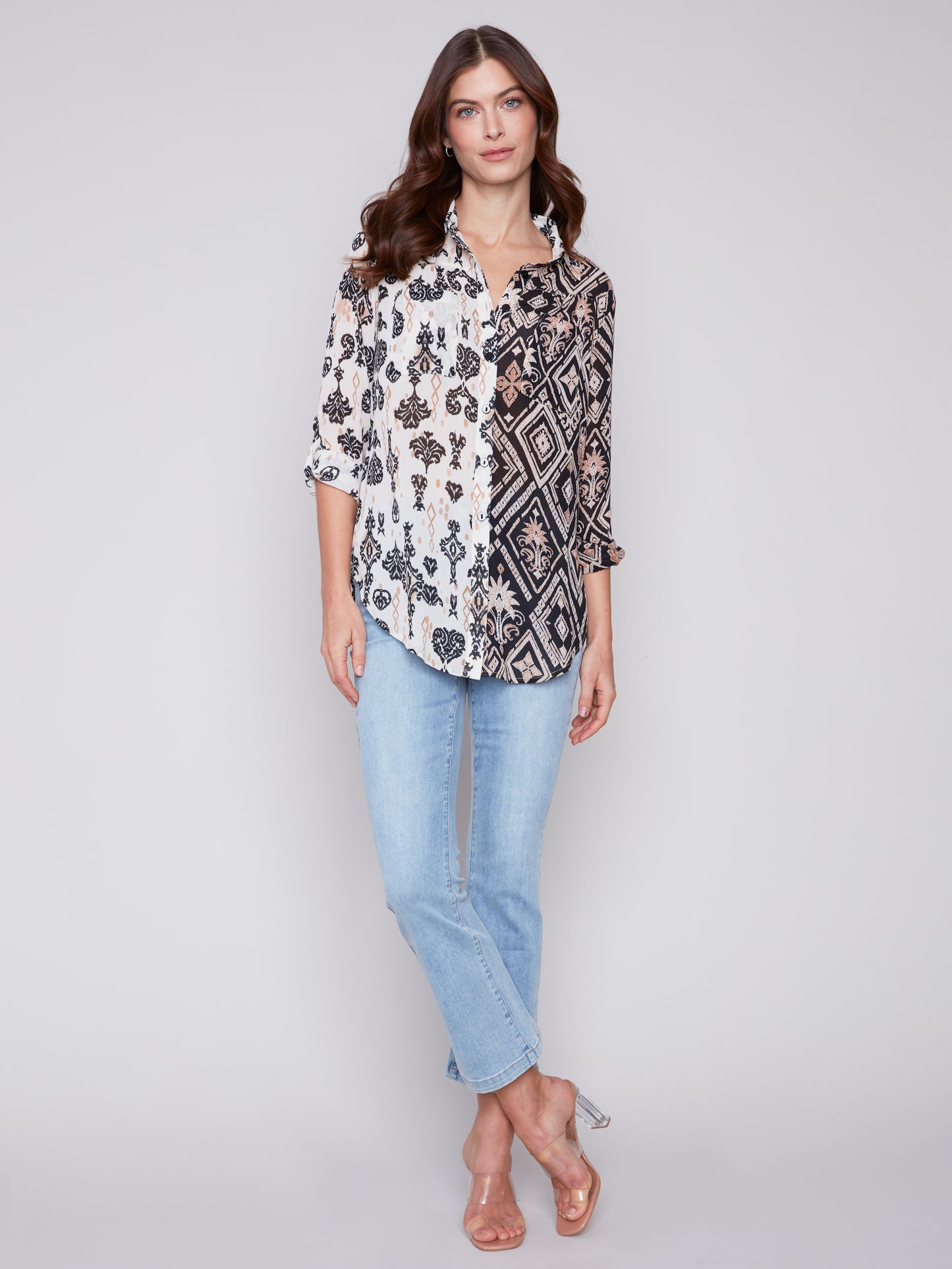 A woman wearing a Charlie B Crinkle Georgette Blouse, a lightweight Damask color printed fabric.