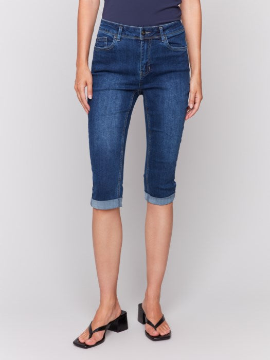 Someone wearing Charlie B's Stretch Denim Pedal Pusher Pants, rolled at the hem with a dark top and block-heeled sandals.