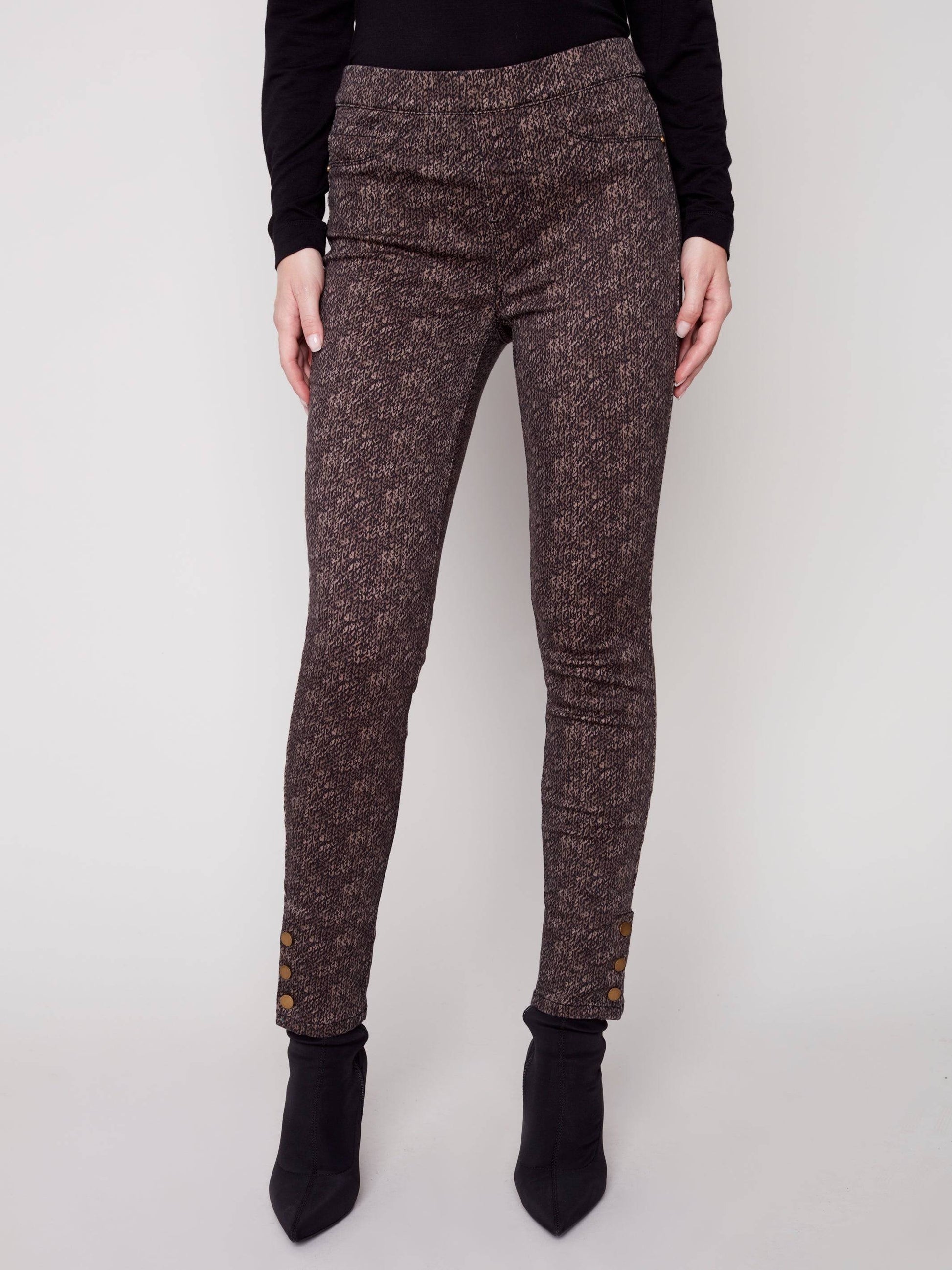 The model is wearing a black turtleneck and brown Charlie B Printed Twill Pull On Pant.