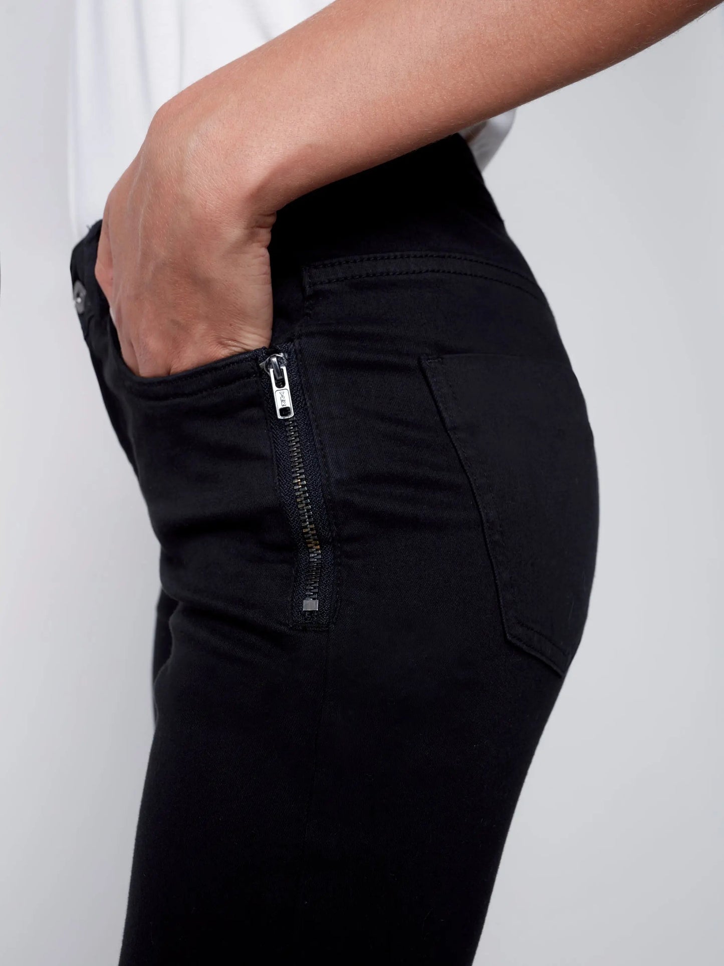 A woman wearing comfortable Charlie B Side Zip Pocket Skinny Jeans.