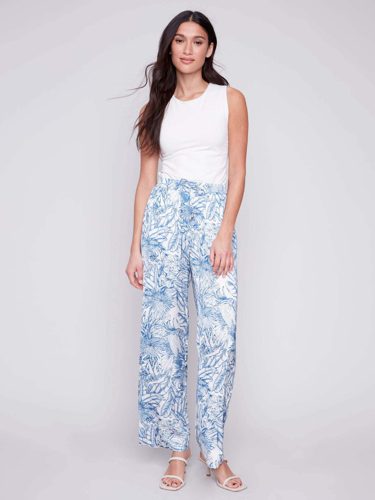 A woman wearing Charlie B's Printed Satin Wide Leg Pant.