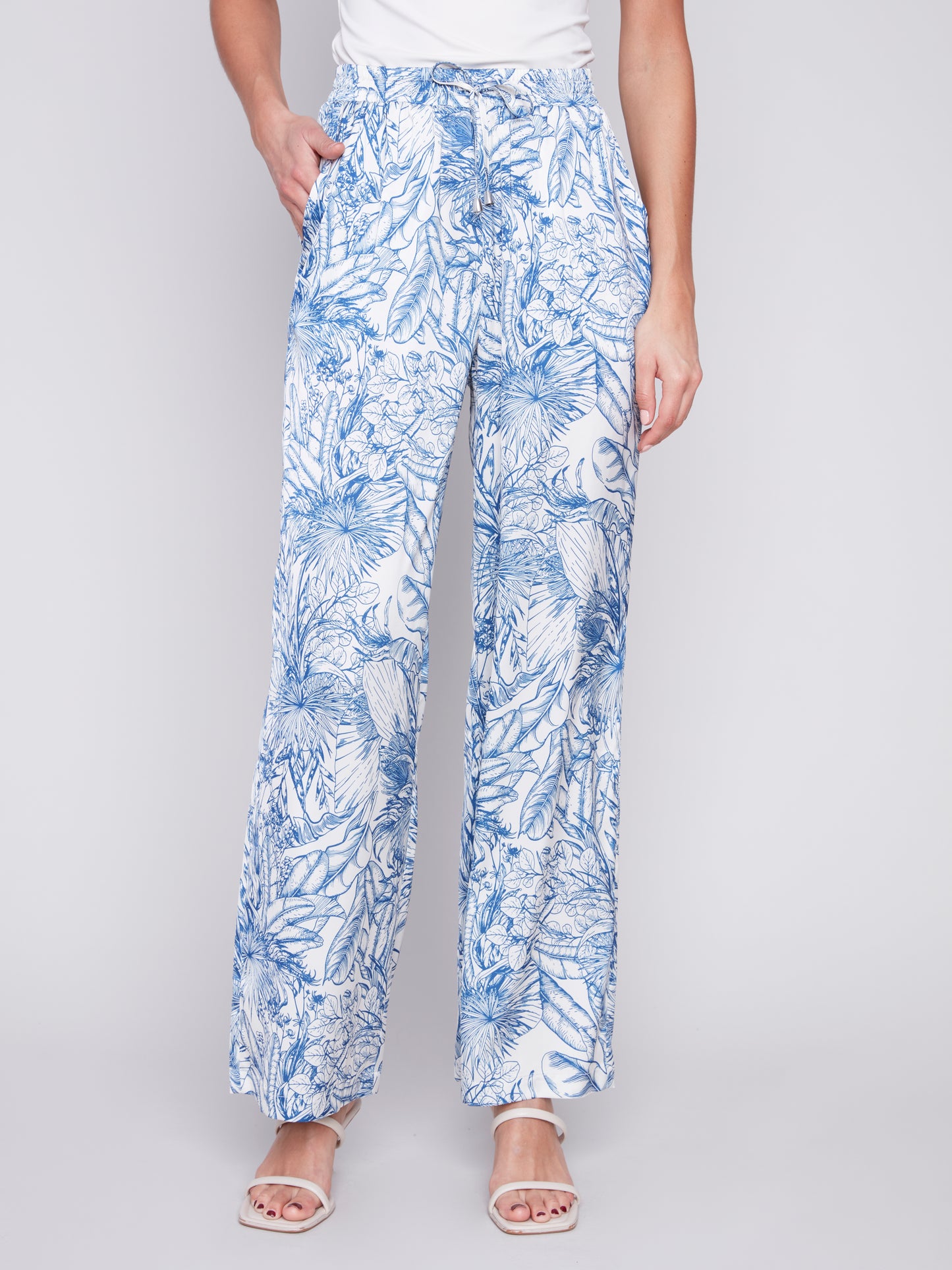 A woman wearing Charlie B's Printed Satin Wide Leg Pant.