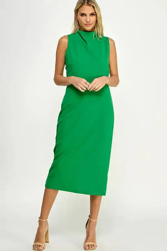 A model wearing a Solid Mock Neck Midi Dress | Kelly Green by Don't Be Chy Boutique.