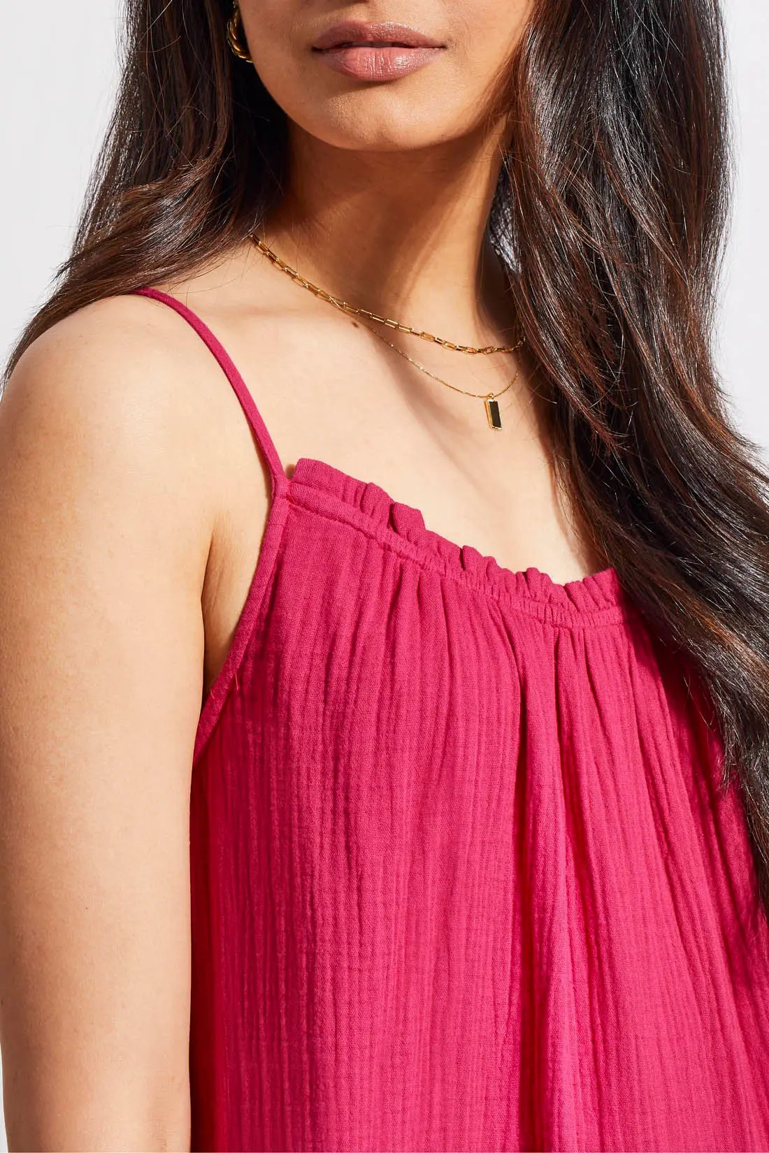 Woman in a Tribal fuchsia sleeveless maxi dress with a flowy design and ruffled hem, standing against a neutral background.