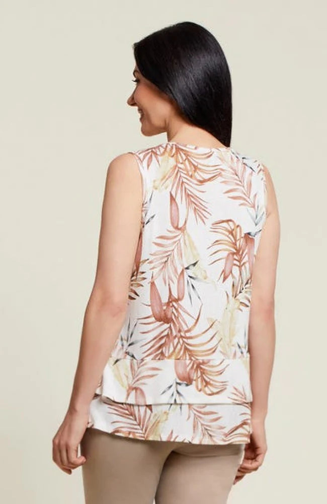 The back view of a woman wearing a stylish Tribal Palm Leaf Tiered Tank Top.