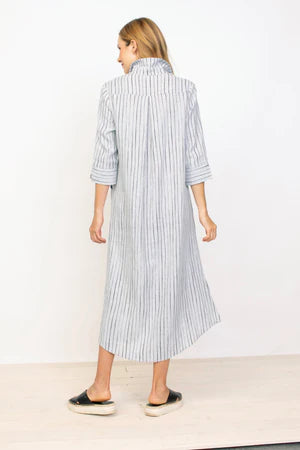 Woman posing in a Habitat 3/4 Sleeve Striped Shirt Dress with notched cuffs and black sandals against a plain background.