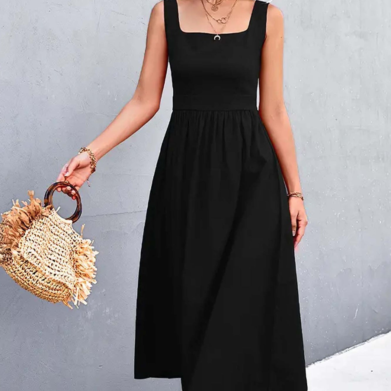 A woman wearing a Square Collar Sleeveless Solid A Line Midi Dress in Black color from Don't Be Chy Boutique.