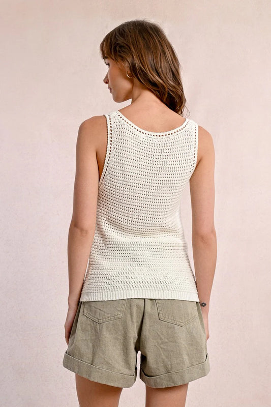 A woman models the Molly Bracken Knitted Tank Top with high-waisted pants against a neutral background.