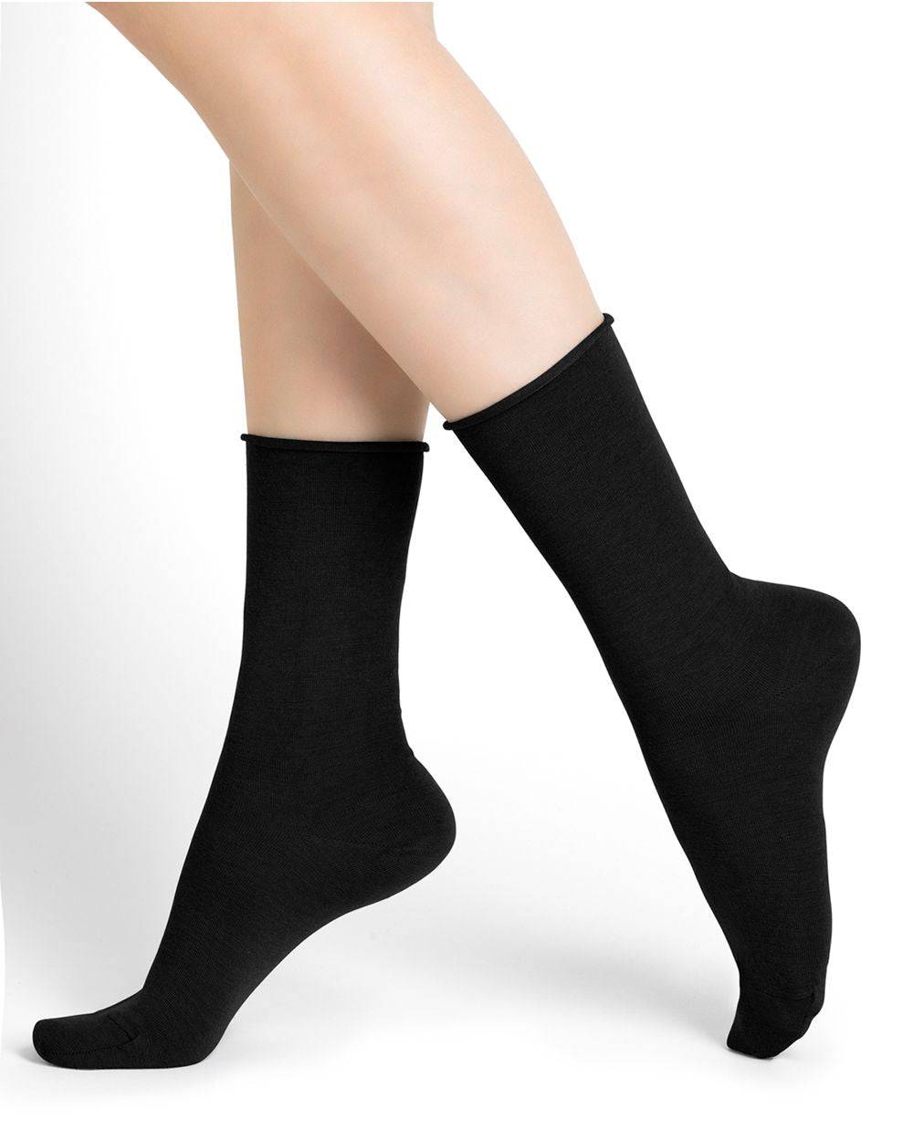 The legs of a woman wearing Bleuforet 6700 Roll Top Wool Socks.