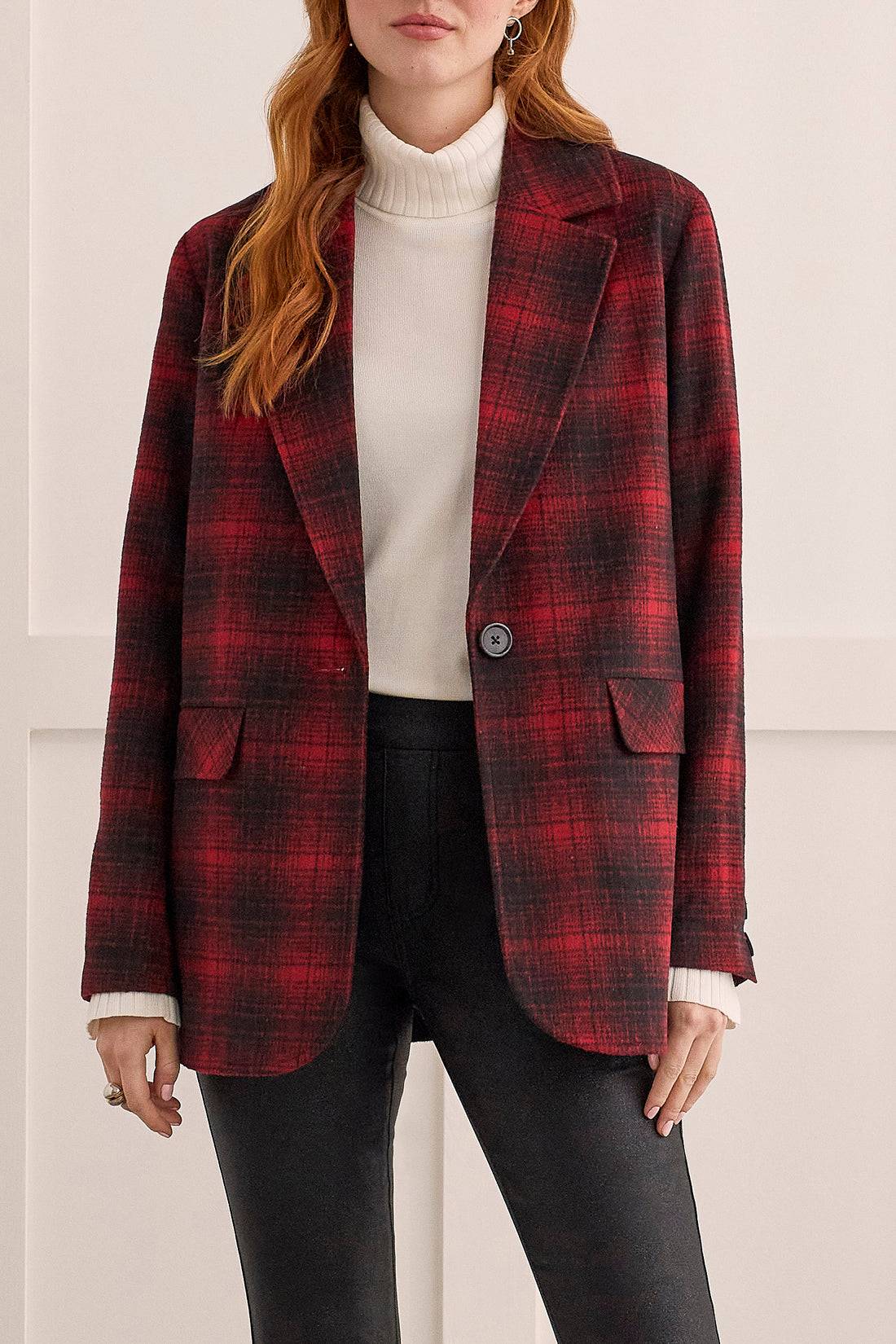 A stylish woman wearing a Tribal Red/Black Plaid Jacket.