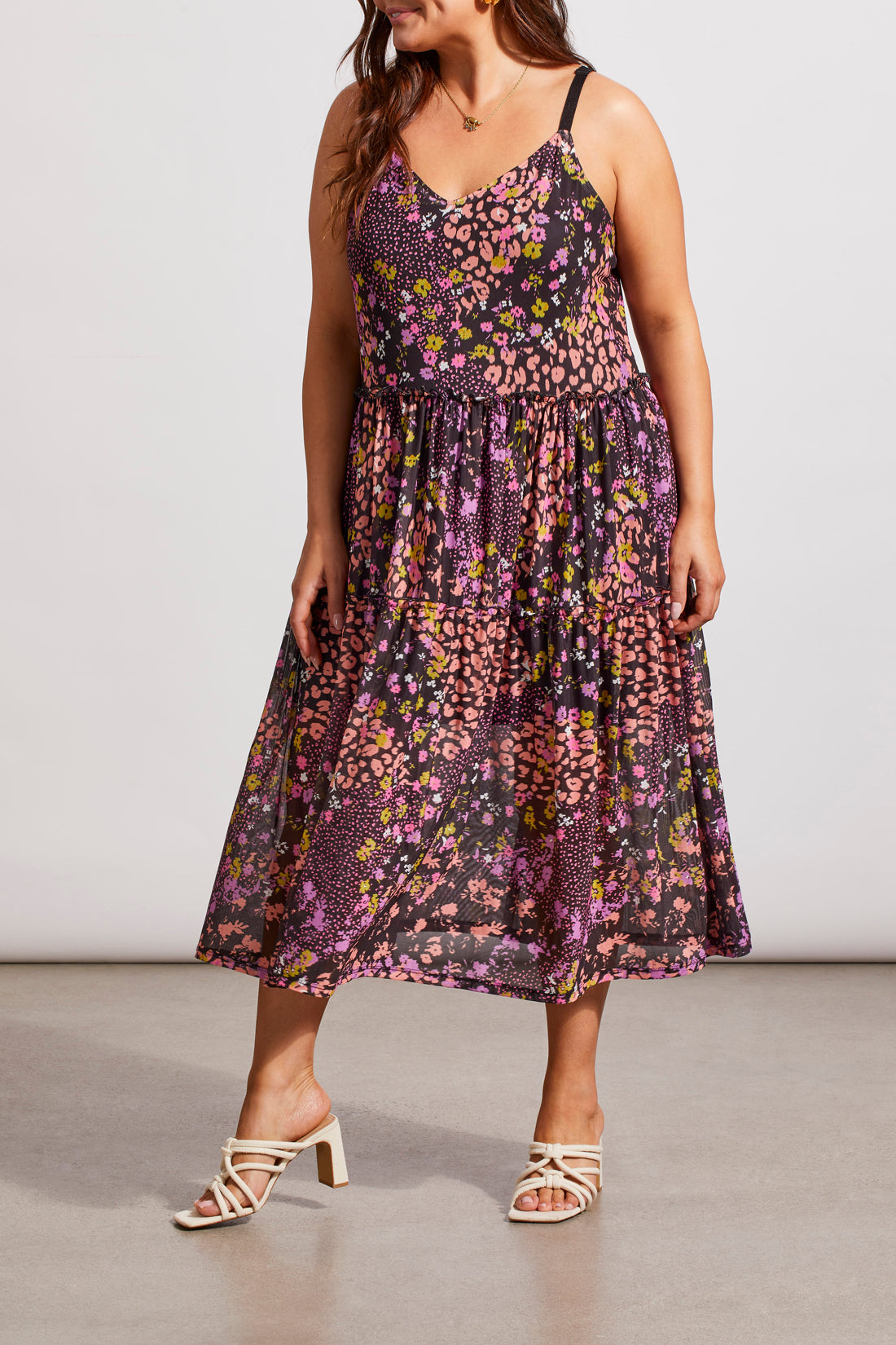 A woman in a Tribal Two Way Strappy Dress and white heels, posing in a studio setting.